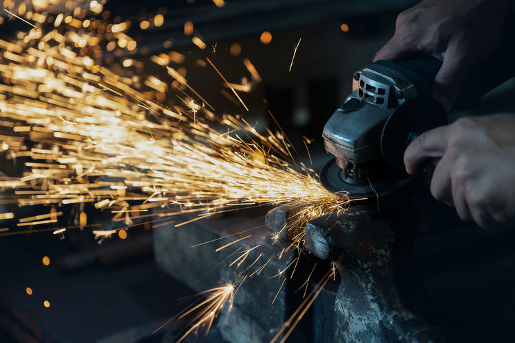 Cropped hands of man working at workshop