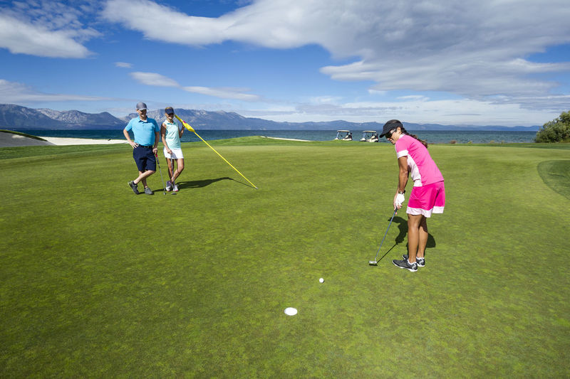 Rear view of women on golf course