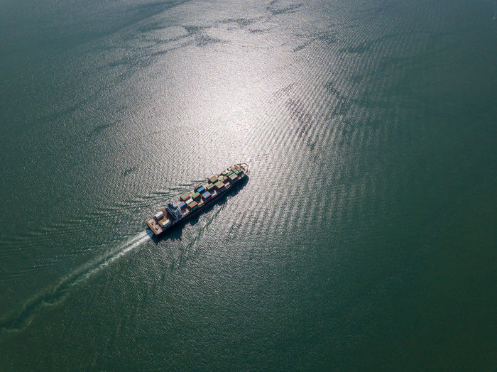 Aerial view of container ship in sea