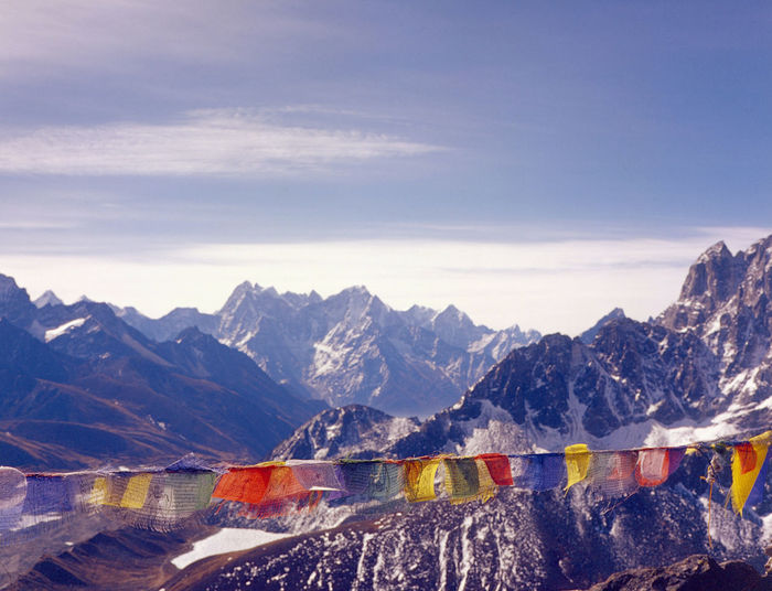 Scenic view of bunting against mountains and sky