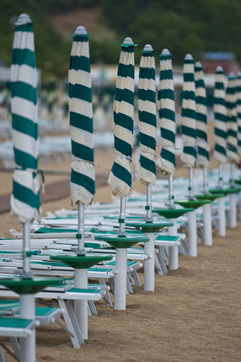 Row of chairs on beach