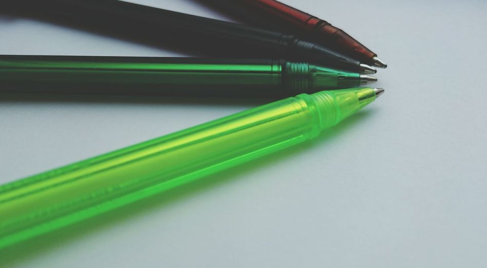 Close-up of ballpoint pens on table