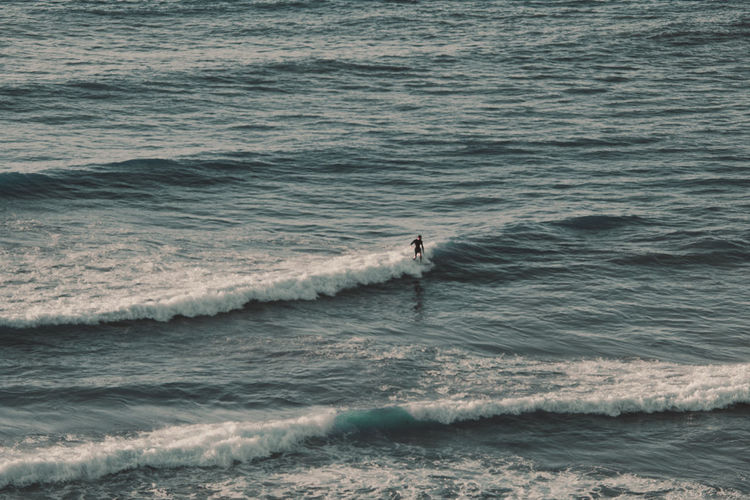 High angle view of man surfing in sea