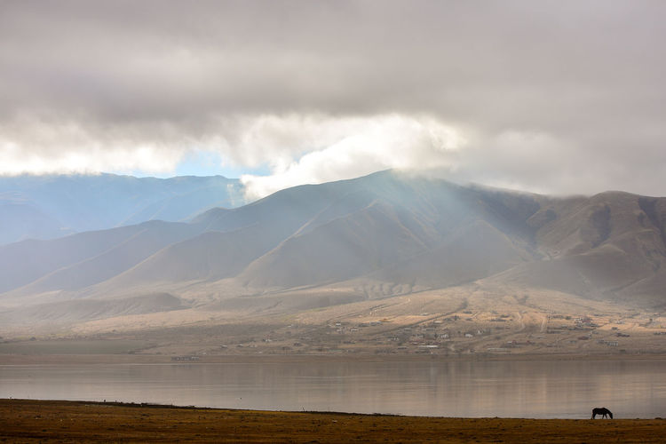 Cloudscape over river and mountain
