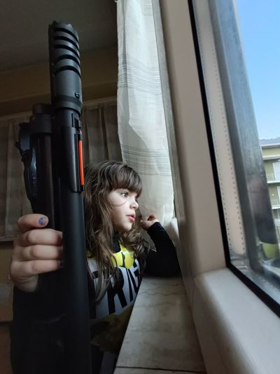 Ukrainian little girl with rifle