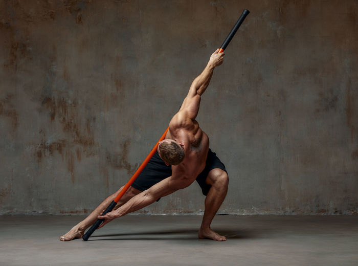 Athlete exercising against wall