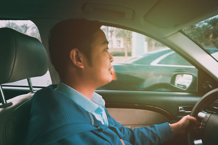 Portrait of boy sitting in car