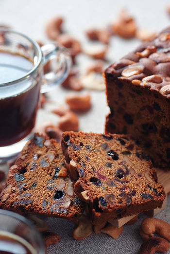 Sliced fruit cake with a cup of coffee