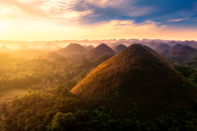 Scenic view of mountains against sky during sunset