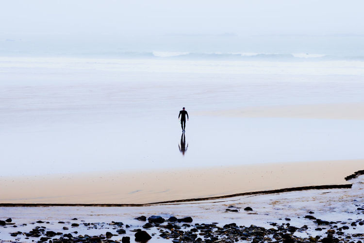 Man walking at beach