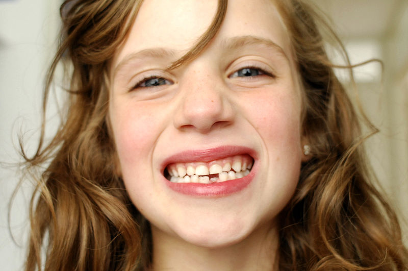 Close-up portrait of cheerful girl