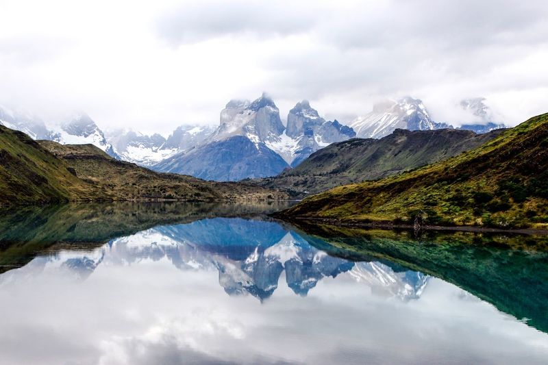 Scenic view of lake against cloudy sky