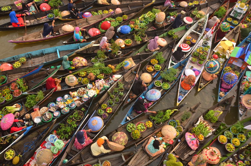 High angle view of people at floating market stall