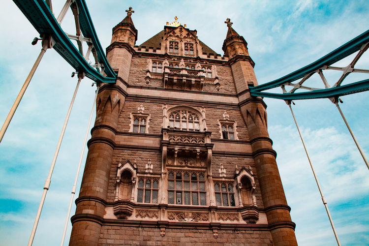 Low angle view of historical iconic tower bridge in london, united kingdom against blue sky 