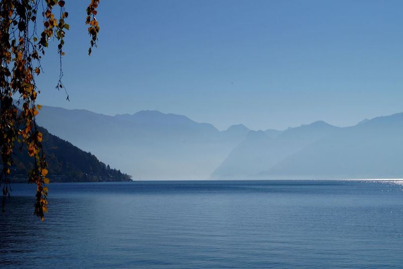 Scenic view of sea with mountains in background