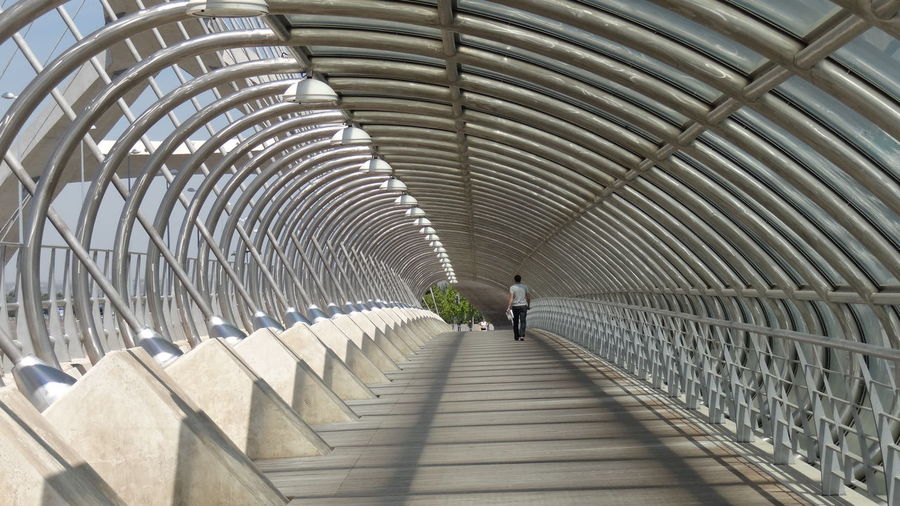 Man walking on bridge