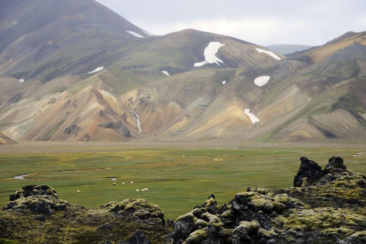 Scenic view of landscape and mountains against sky