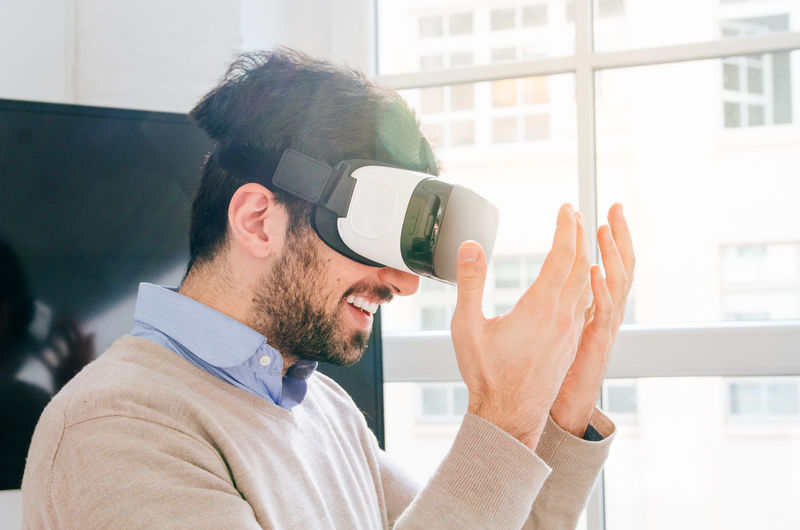 Portrait of man wearing virtual reality simulator