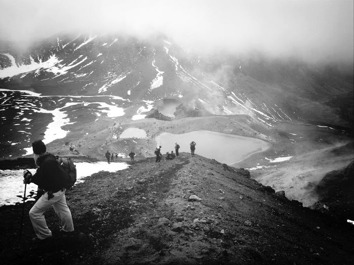 High angle view of hikers at tongariro alpine crossing