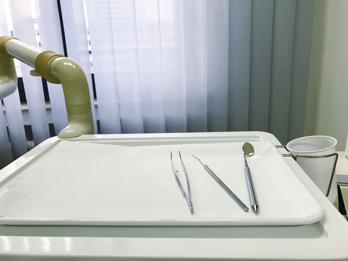 High angle view of dental equipment on tray in clinic