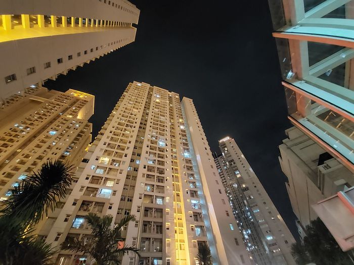 Low angle view of illuminated buildings at night