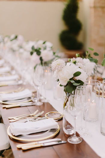 Place setting on dining table during wedding ceremony