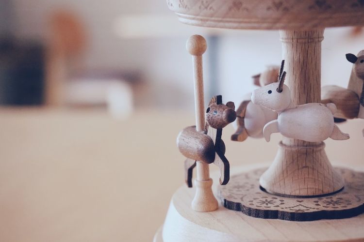Close-up of figurine on table at home