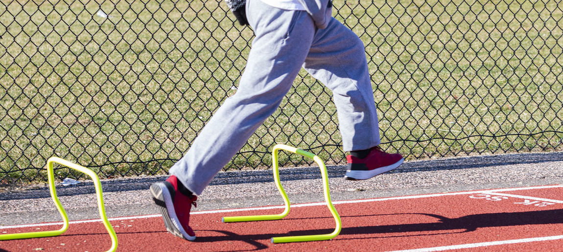 Low section of man playing soccer