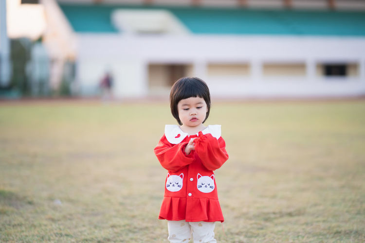 Cute girl standing at park