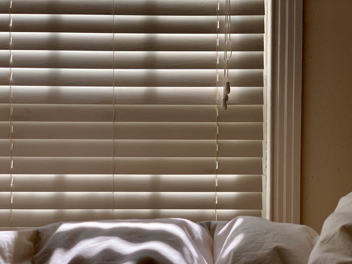 Close-up of blinds on window