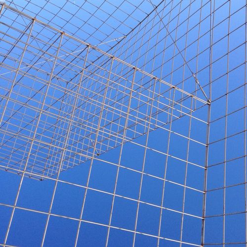 Full frame shot of modern building against blue sky