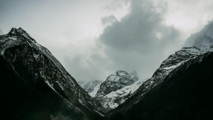 Dramatic snowy mountains dombay caucasus mountains banner