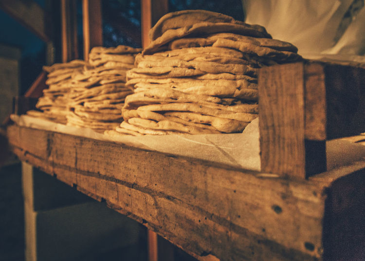 Close-up of flatbread stacked on table