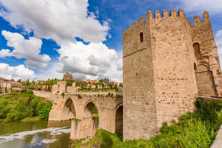 Scenic view of medieval san martin's bridge offering views of the tagus river  toledo, spain
