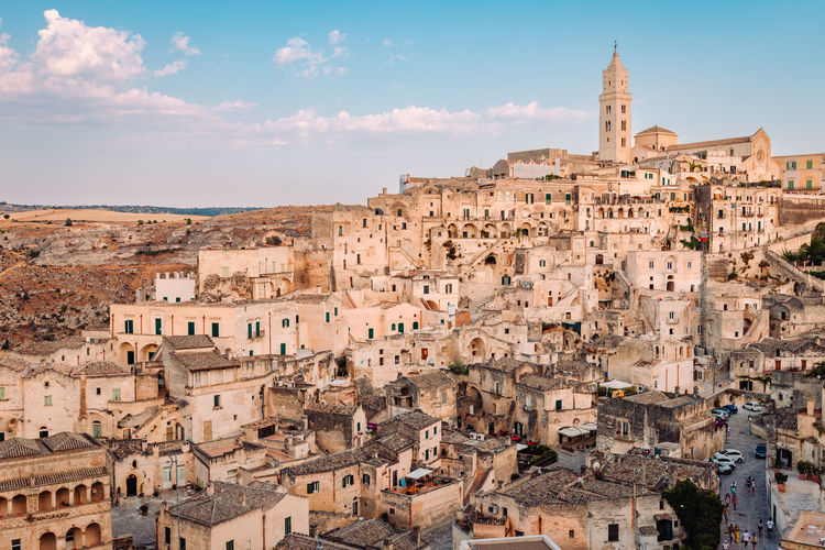 View of the sassi di matera from the belvedere di san pietro barisano, blue sky with clouds