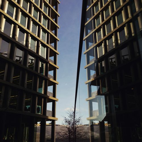 Low angle view of modern building against sky