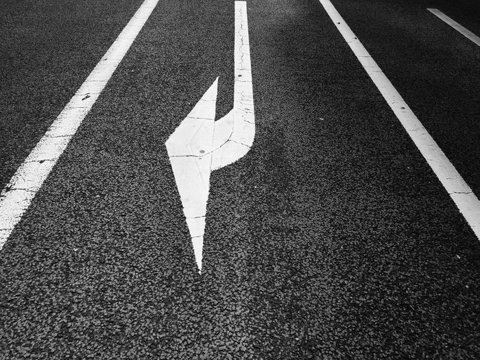 Arrow sign on road