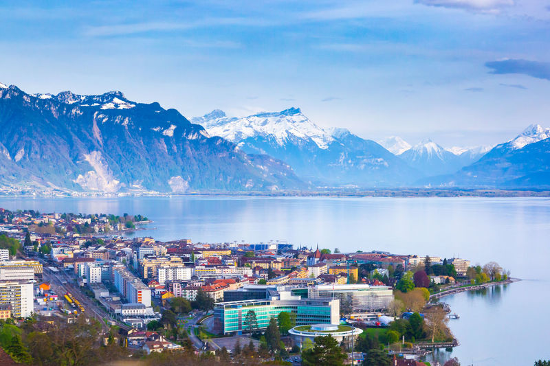 Mountains and houses by lake in town