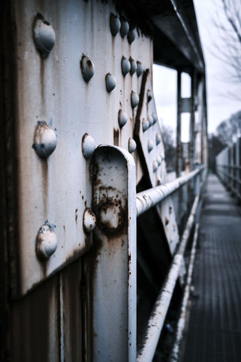Close-up of rusty metal bridge