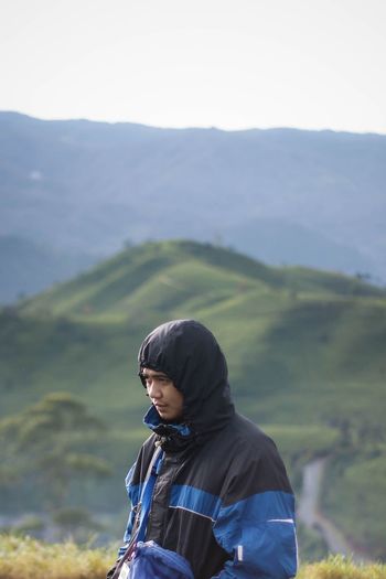Rear view of man looking at mountains