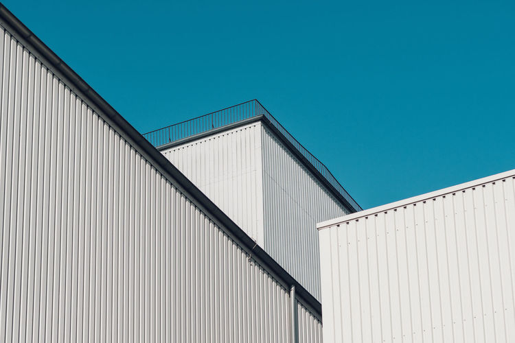 3 layers Architecture blue building exterior building story built structure Clear sky Colors and 17.62° The Graphic City Architecture Blue Building Exterior Building Story Built Structure Clear Sky Day High Section Industry No People Outdoors White Minimalist Architecture