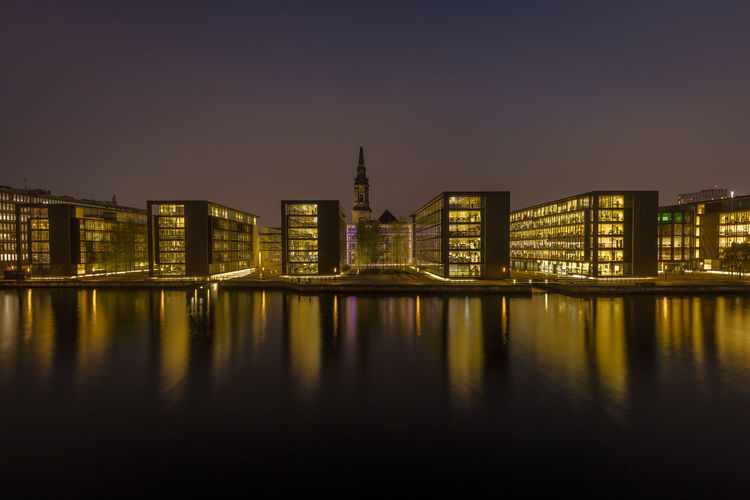 Office buildings in copenhagen with a church behind