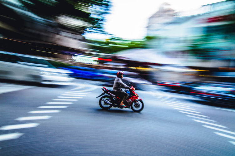 Man riding motorcycle on road