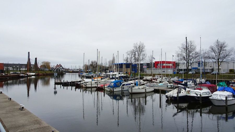 Boats moored at harbor