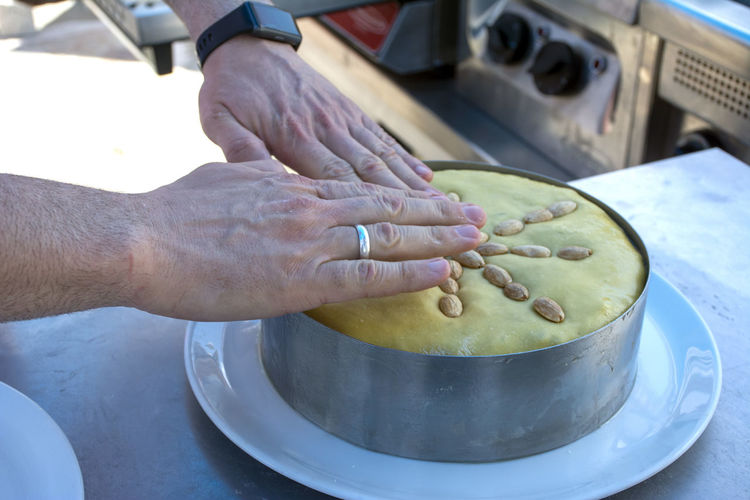 Cropped hand of man preparing food