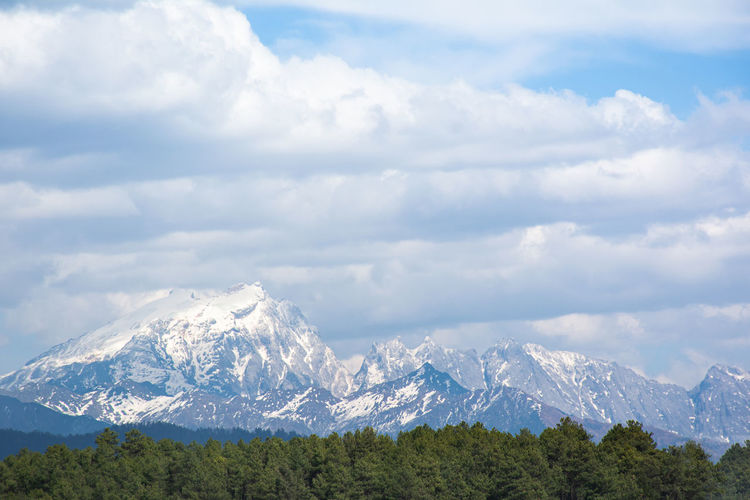Scenic view of snowcapped mountains against sky