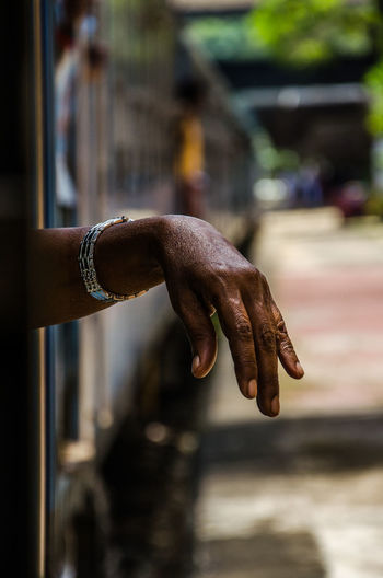 Close-up of man hand on street