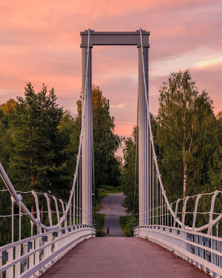 Footbridge over footpath during sunset