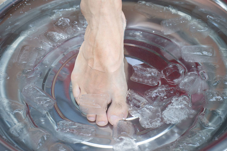 High angle view of human hand in water