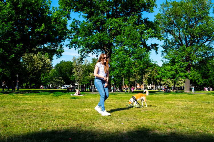 People and dog in park